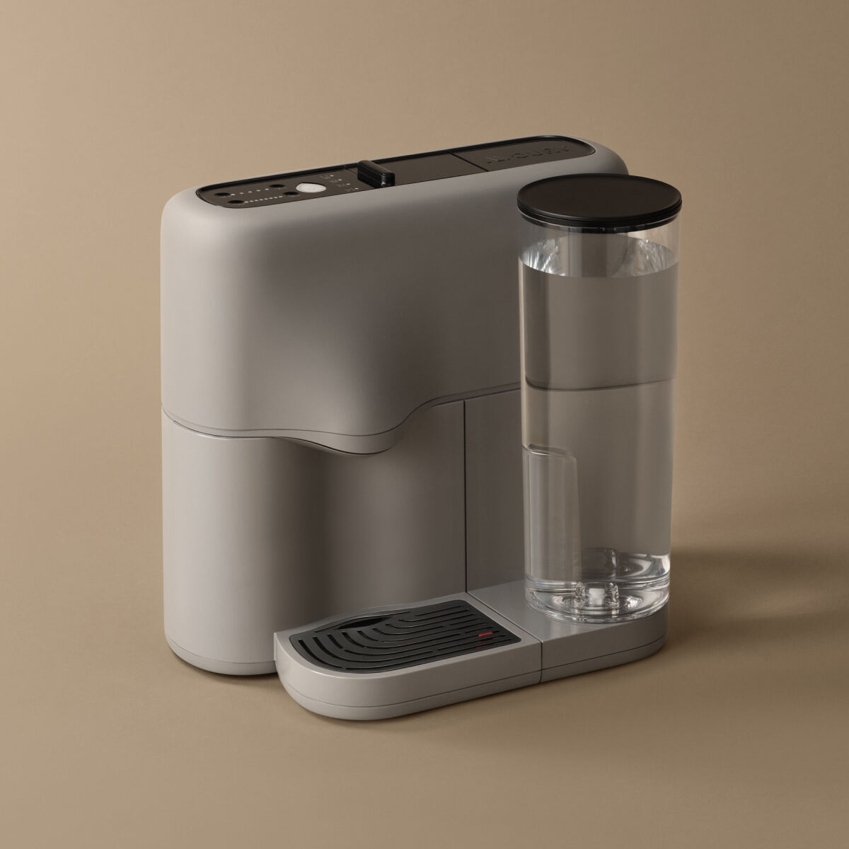 Grey tea machine on beige background.