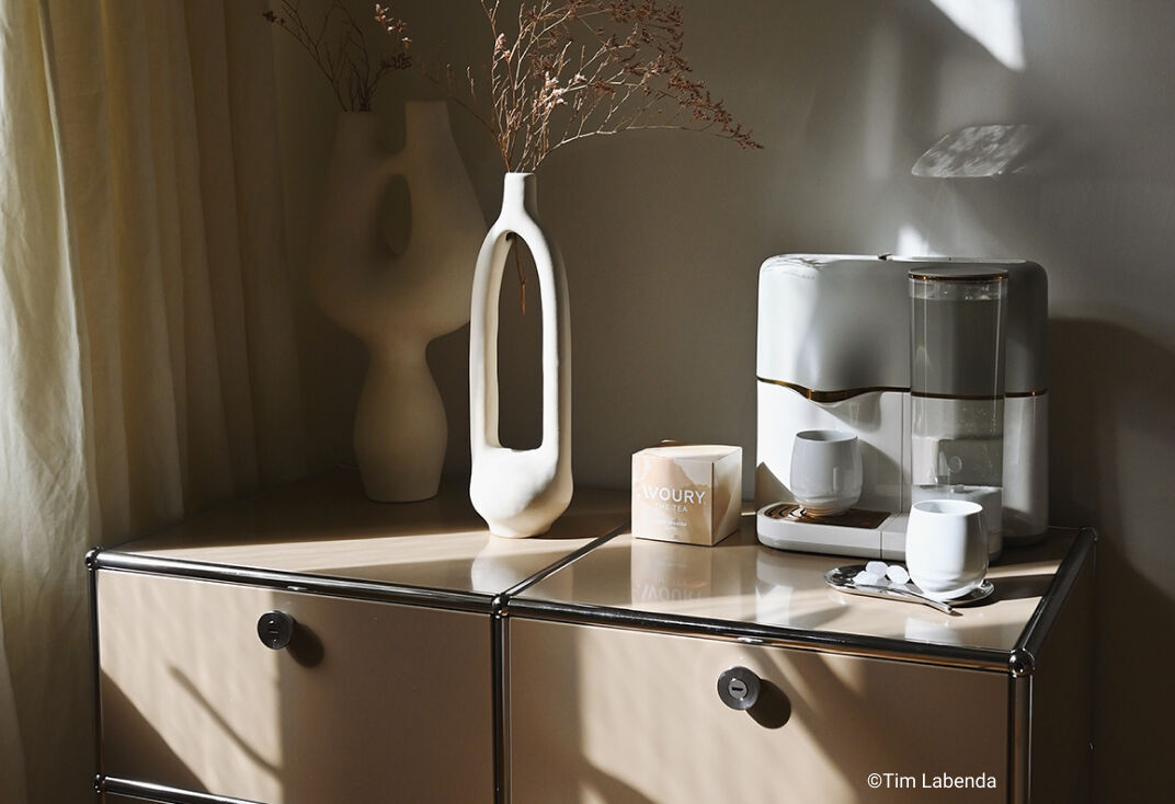 Avoury One tea machine on a USM haller sideboard with decoration