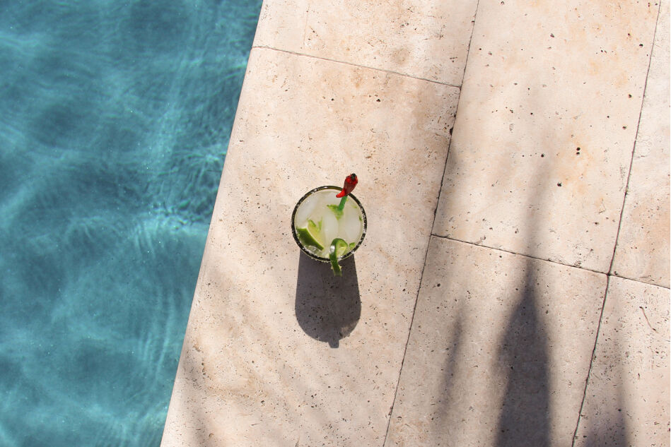 Iced tea next to a pool